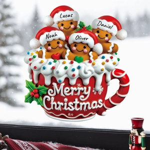 Custom Christmas gingerbread family sitting in a red Merry Christmas mug ornament