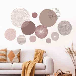 Detail of Morandi geometric circle wall stickers set on white wall above a sofa