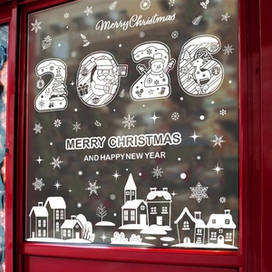 Detail of 2026 Christmas window sticker with Santa and snowman silhouettes on glass