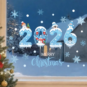 Detail of 2026 Christmas window decals featuring blue snowmen and penguins on glass
