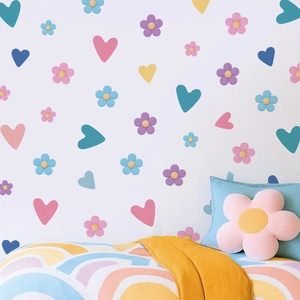 Stickers muraux bohèmes fleurs et cœurs aux couleurs pastel pour déco de chambre de fille