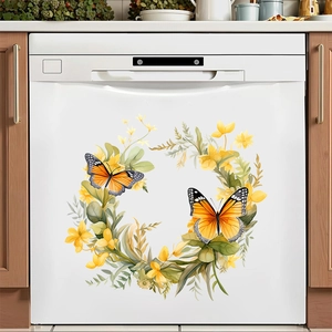 Détail de l'autocollant floral colibri posé sur la façade d'un lave-vaisselle blanc