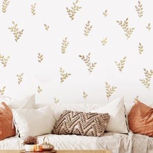 Minimalist green plant wall stickers featuring eucalyptus leaves on a modern living room wall