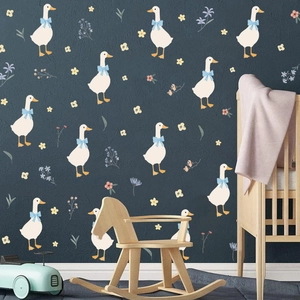 Détail de stickers muraux canards bohèmes avec fleurs dans une chambre d'enfant