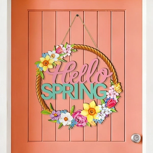 Spring wooden door hanger with Hello Spring text and floral pattern on pink wood door