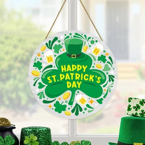 St. Patrick's Day wooden door sign with clovers and gold coins hanging by a window