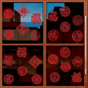 Close-up of traditional red Fu character window stickers and zodiac horse patterns on glass