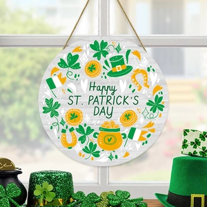Detail of wooden St. Patrick's Day round door sign with clovers and festive elements