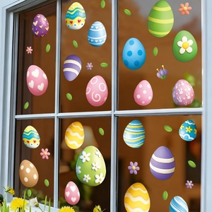 Easter window stickers with colorful eggs, bunnies, and flowers on a glass window pane