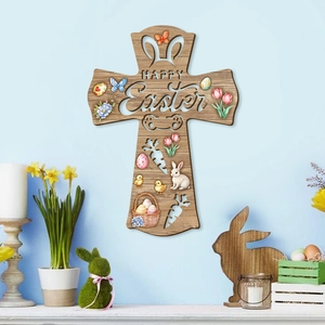 Wooden Easter cross hanging sign with rabbit and egg patterns and Happy Easter text