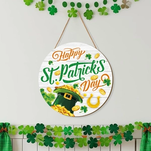 Detail of St. Patrick's Day wooden door sign with lucky shamrock and gold coin designs