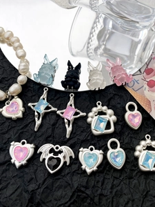 Detailed view of Y2K style rabbit and heart charms with resin gems for DIY jewelry