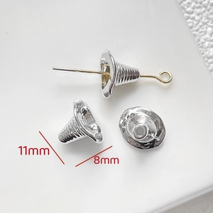 Macro shot of silver bell-shaped bead caps with 11mm height and 8mm base dimensions