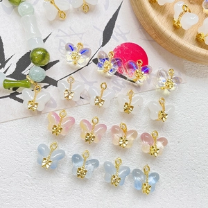 Handcrafted glass butterfly charms with golden bows for DIY jewelry and necklaces