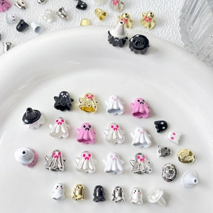 Cute Halloween ghost charms for DIY bracelets in various colors and styles on white tray
