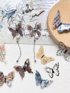 Detail of New Chinese style butterfly earrings with calligraphy patterns and long tassels