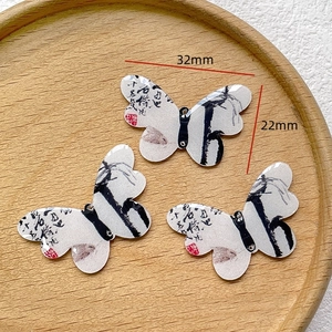 Set of three butterfly pendants with Chinese ink painting and calligraphy motifs