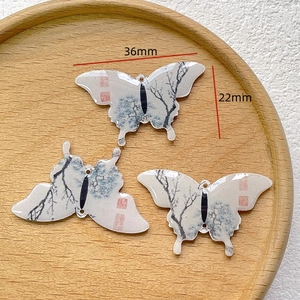 Detail of 36x22mm butterfly pendant with Chinese ink painting and glossy resin finish