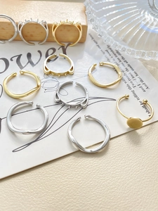 Detailed view of DIY 14k gold and silver plated rings with wave and cat ear designs