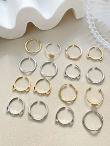 Macro shot of 14k gold-plated adjustable ring blanks with pearl base for DIY jewelry making