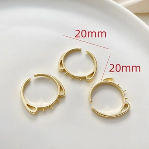 Macro detail of 14k gold plated cat-ear shaped adjustable rings with 20mm outer diameter