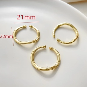 Macro view of 14k gold-plated 21mm wavy rings for DIY jewelry making accessories