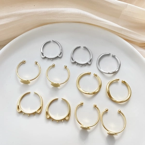 14k gold plated and silver DIY open rings with flat base and cat ear settings in a tray