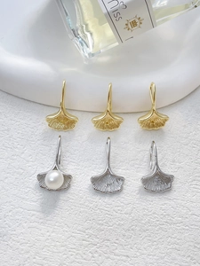 Detailed view of 14k gold-filled ginkgo leaf ear hooks with pearls for DIY jewelry making