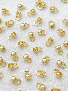 Macro shot of 14k gold-plated jewelry end clasps for DIY bracelet and necklace making