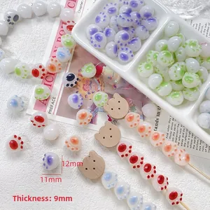 Macro detail of colorful cat paw beads for DIY jewelry with 11mm by 12mm dimensions