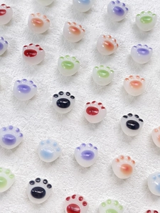 Colorful resin cat paw beads in various shades for DIY jewelry and necklace crafting