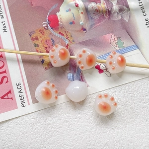Detailed view of cute resin cat paw beads for DIY jewelry and handmade crafts accessories
