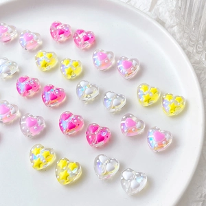 Iridiscent heart-shaped resin beads with star and heart patterns for DIY jewelry craft