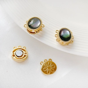 Macro detail of magnetic clasp connectors with iridescent shell inlay for DIY jewelry