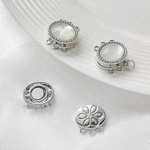 Macro view of 3-hole magnetic clasp with white mother of pearl inlay for jewelry