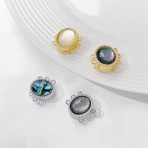 Gold and silver oval magnetic clasps with shell inlay for multi-strand jewelry