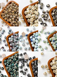 Macro detail of various vintage pumpkin ceramic beads with reactive glaze for DIY jewelry