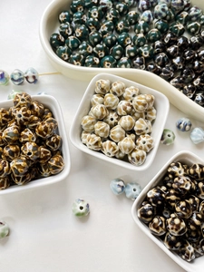 Macro shot of 10mm retro ceramic lantern beads with vintage kiln glaze for DIY jewelry