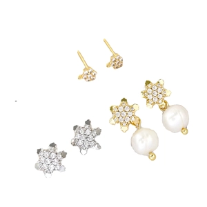 Gold-plated snowflake earrings set with sparkling cubic zirconia and elegant pearls