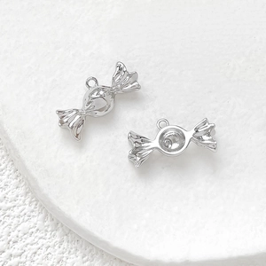 Detail of silver candy pendant with cubic zirconia inlay for DIY jewelry making