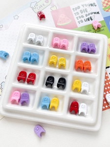 Detailed view of colorful resin smiley face beads for DIY jewelry and nail art