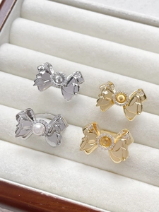 Detail of 18k gold plated bow ring with zircon setting and DIY pearl mounting base