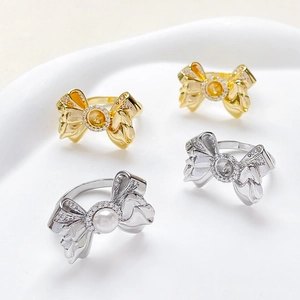 Elegant 18k gold plated bow rings with sparkling cubic zirconia and white pearls