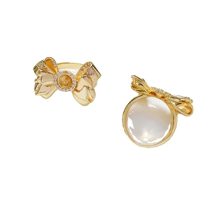18k gold-plated bow ring setting with cubic zirconia and white pearl element
