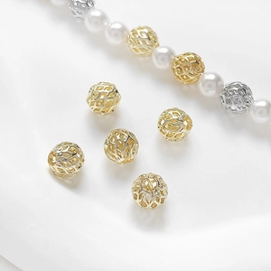 Close-up of 14k gold plated hollow geometric beads for DIY jewelry making