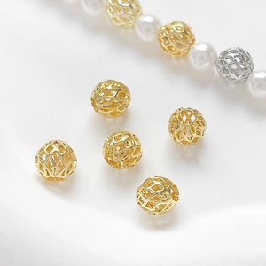 Detailed view of 14k gold-plated hollow geometric mesh beads for DIY jewelry making