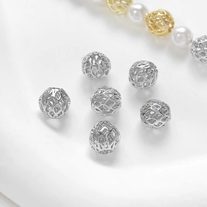 Macro detail of 14k gold-plated hollow honeycomb beads for DIY jewelry making
