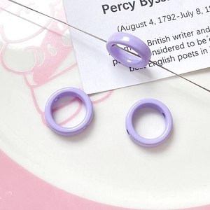 Macro shot of light purple smooth alloy flower beads with holes for DIY jewelry making