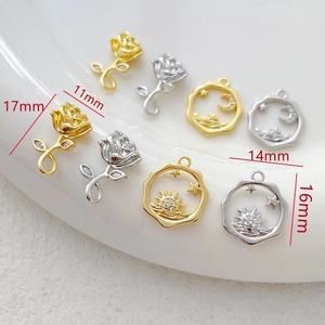 Detailed view of 14k gold-plated rose and hollow star-moon charms with sizing info