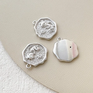 Detailed macro view of 14k gold plated Little Prince charms for DIY jewelry making
